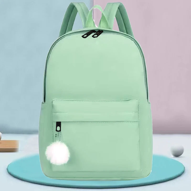Elegant Casual Daypack, Solid Nylon Backpack with Adjustable Shoulder Strap and Pom Pom Charm for Women Daily Use All Occasions