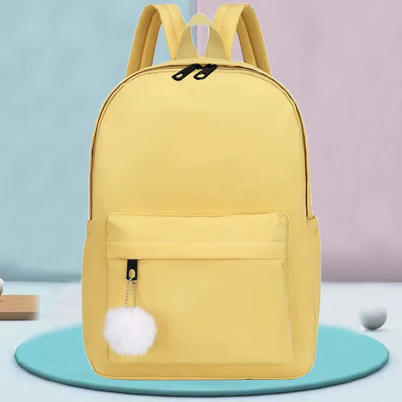 Elegant Casual Daypack, Solid Nylon Backpack with Adjustable Shoulder Strap and Pom Pom Charm for Women Daily Use All Occasions