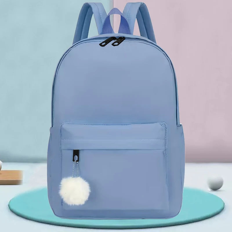 Elegant Casual Daypack, Solid Nylon Backpack with Adjustable Shoulder Strap and Pom Pom Charm for Women Daily Use All Occasions